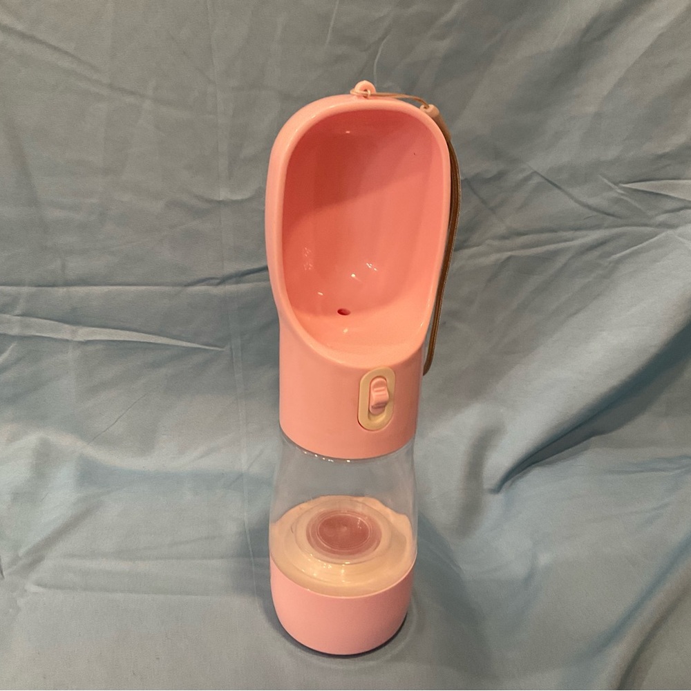Portable dog water & food carrier.  Pink & white, non-leak